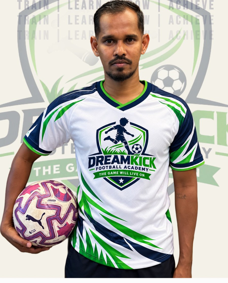 Anuj Suresh, DreamKick founder, holding a football in the academy jersey